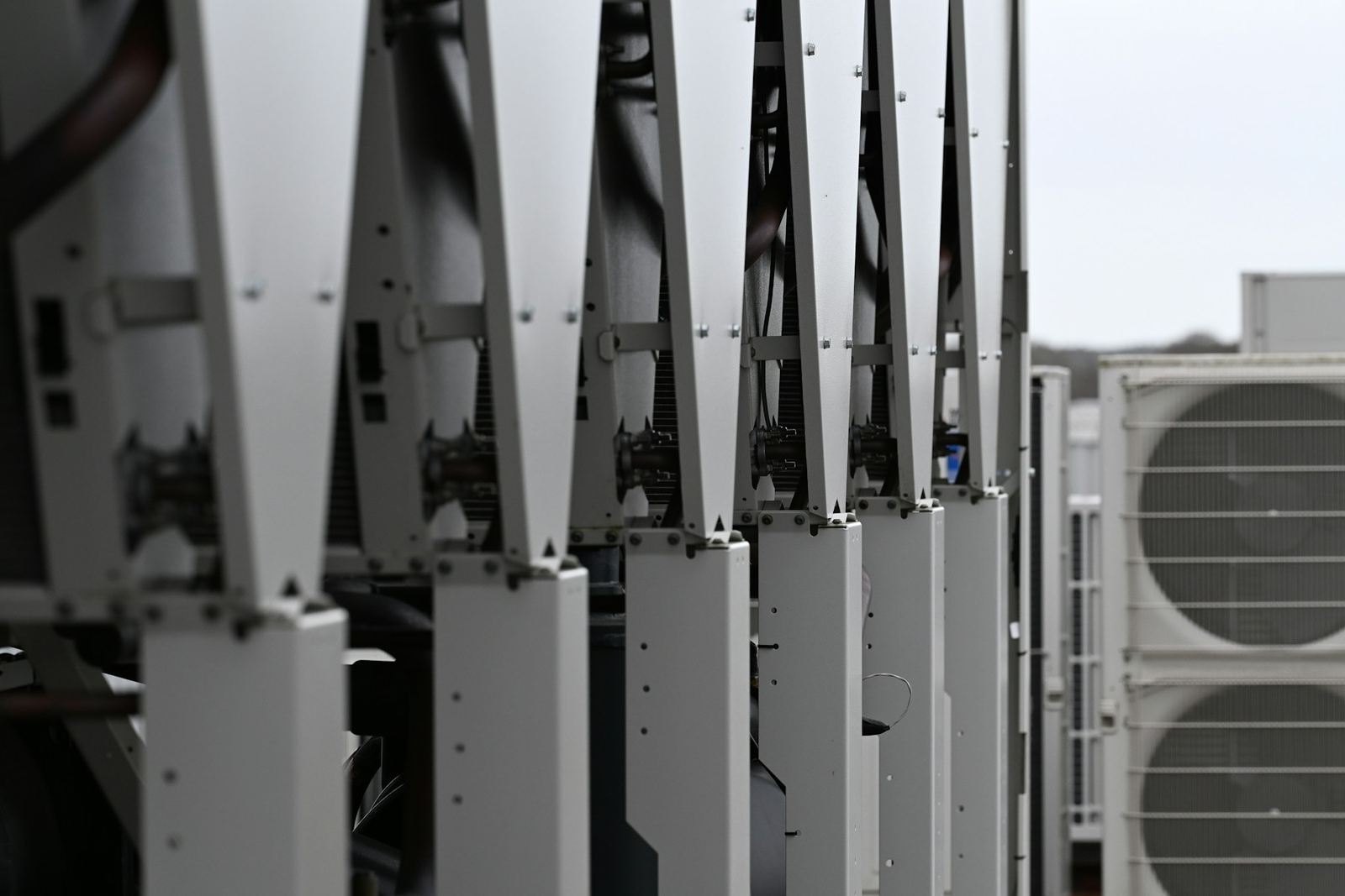 Row of commercial HVAC units on a rooftop